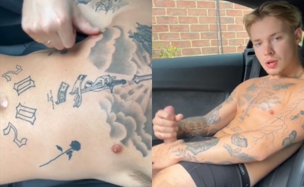 Handsome tattooed boy jerking off in car