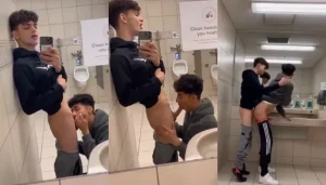 Naughty twinks fucking a public toilet